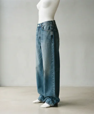 Mode Of One Mccarren baggy-fit wash jeans in blue, shown in a full-length view on a mannequin to display the relaxed fit.